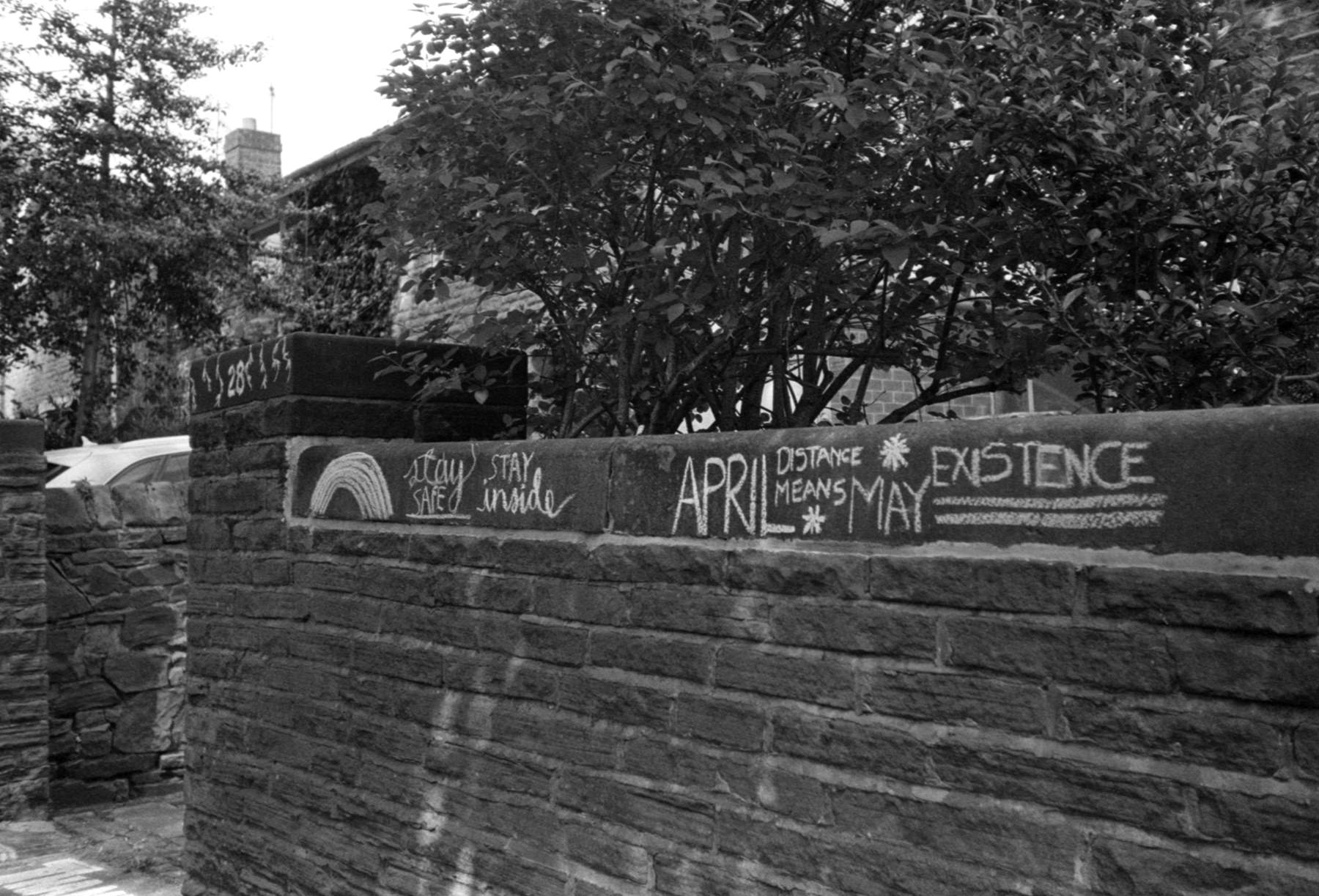 Supportive messages written in chalk on a wall